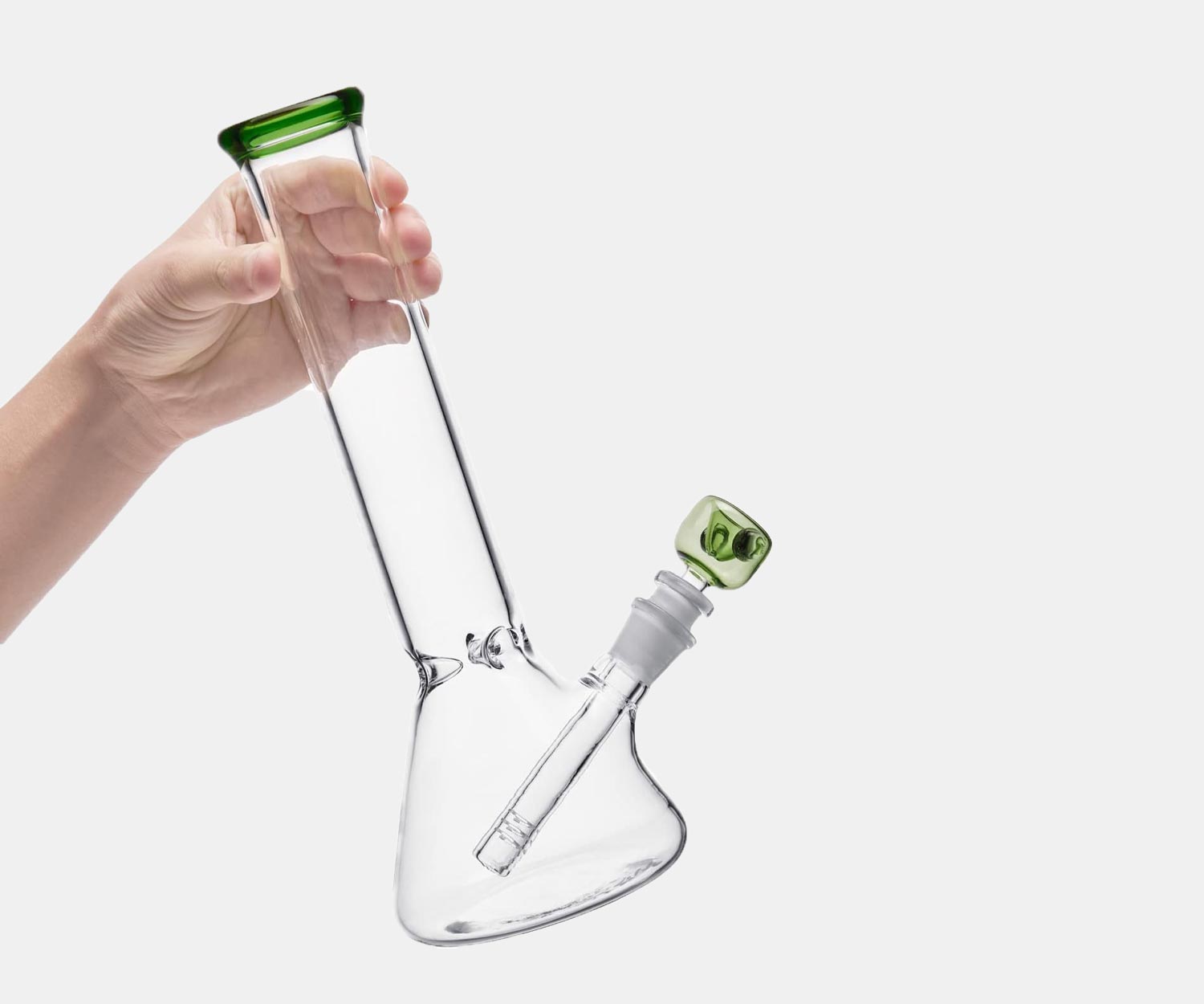 Hand holding the green beaker bong.