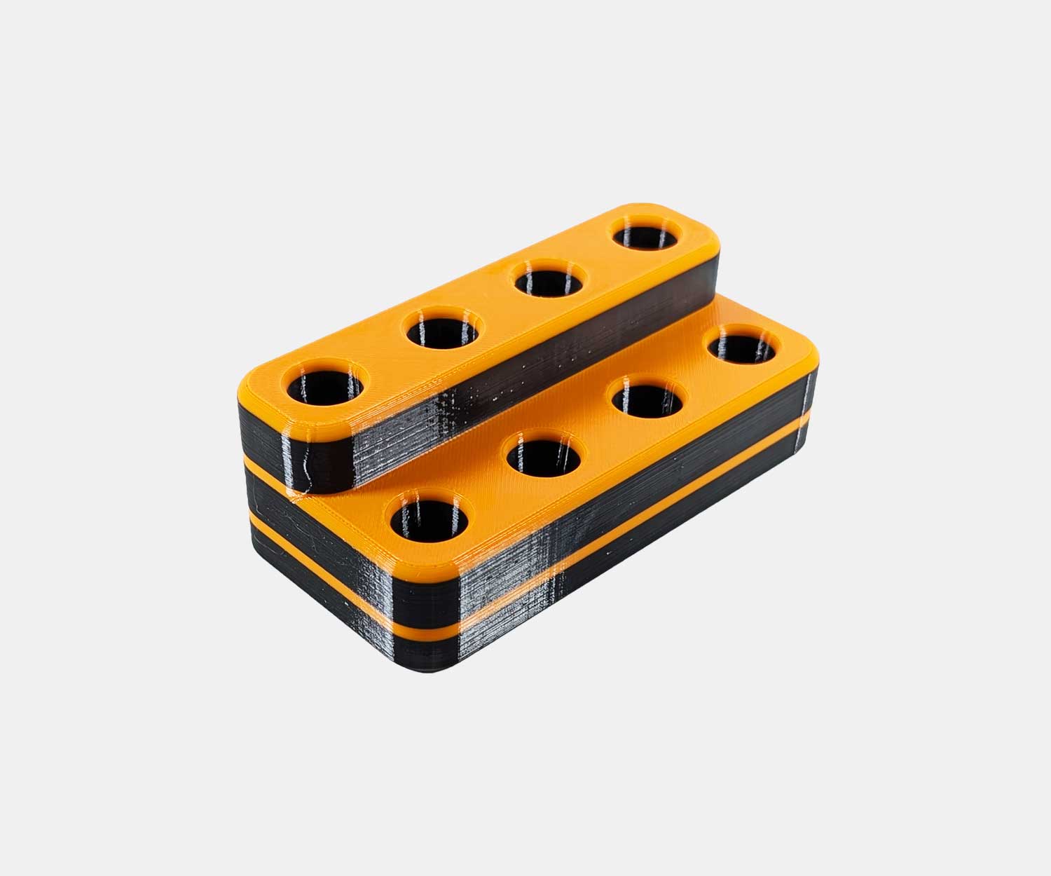 Side view of the Heavy Hitter bowl holder in orange