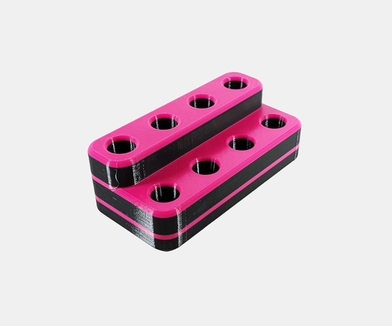 Side view of the Heavy Hitter bowl holder in pink